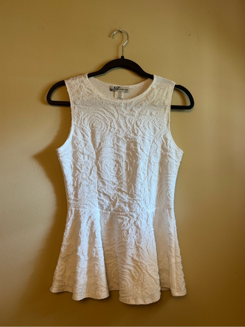 Textured White Sleeveless Peplum Top